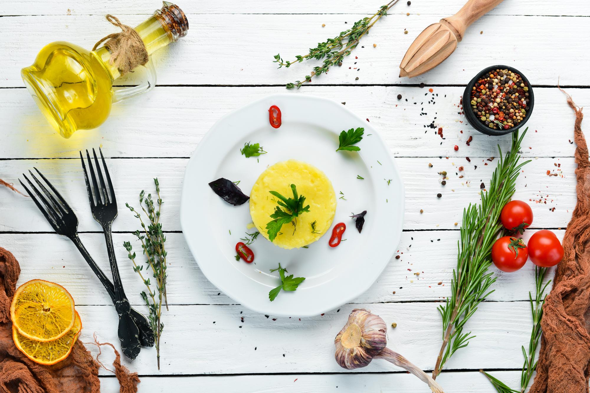 Fresh meal on wooden table with herbs